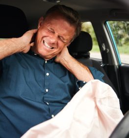 Male Motorist With Whiplash Injury In Car Crash With Airbag Deployed