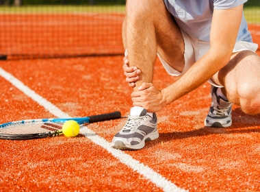 sports-injury-close-up-of-tennis-player-touching-2022-12-16-13-28-07-utc